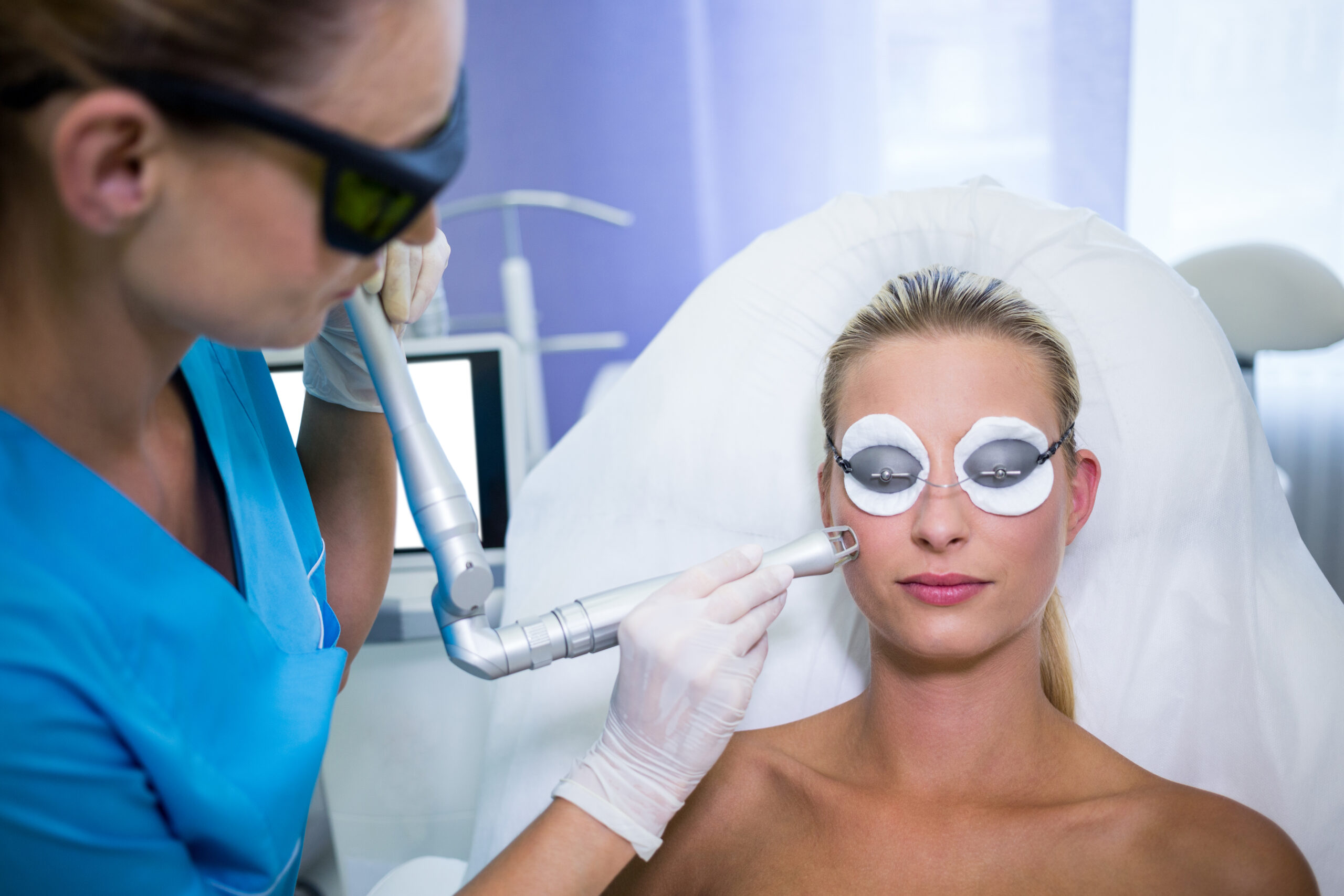 Female patient getting rf lifting procedure in a beauty saloon